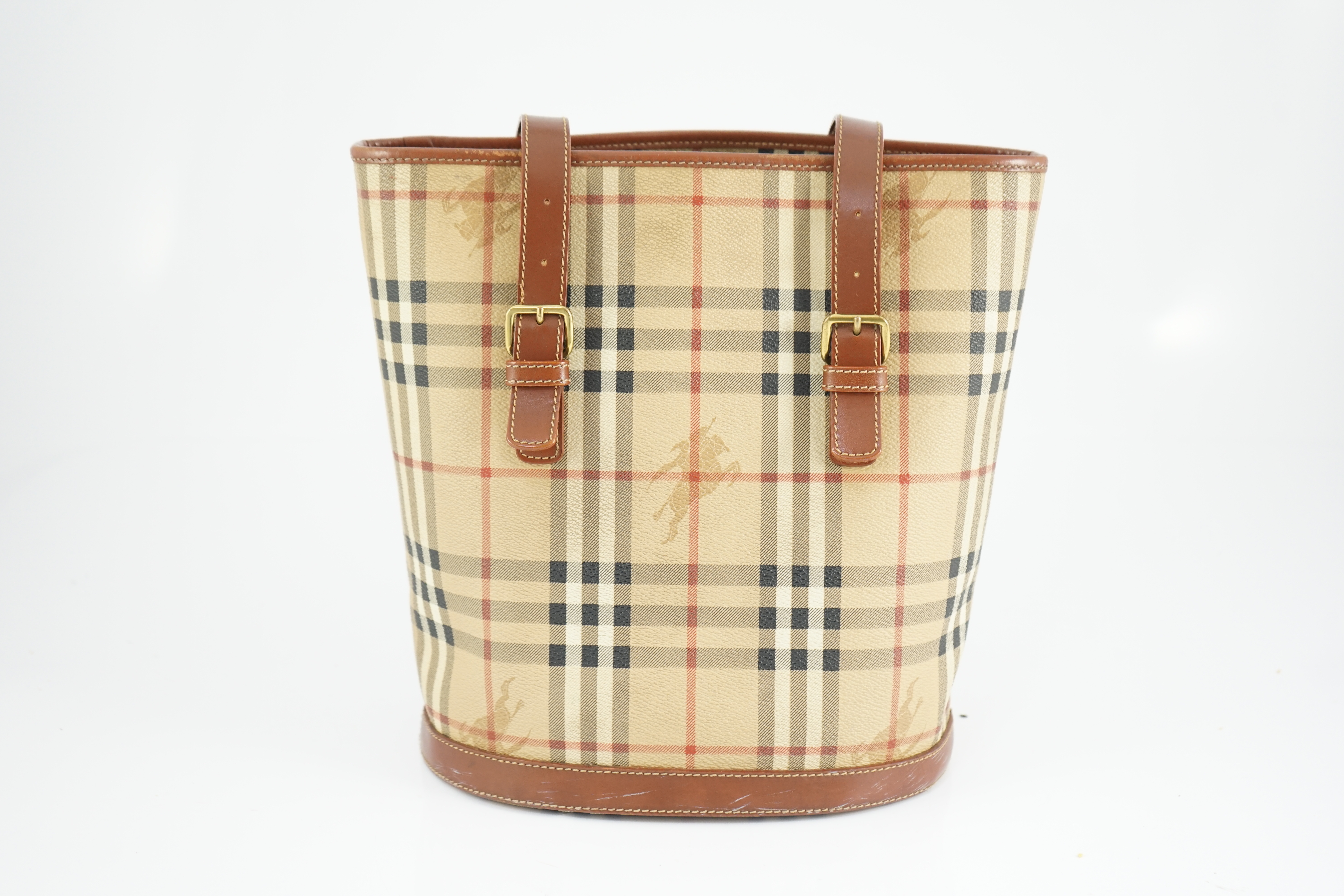 A Burberry Beige/Brown Haymarket coated canvas and leather bucket bag, wallet, cosmetic pouch and small zip case Bag: width 28cm, depth16cm, height 28cm. Wallet: width 20cm, depth 2cm, height 10cm. Cosmetic pouch: width1